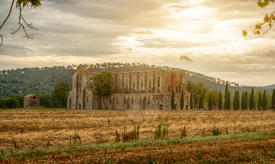 San Galgano, Chiusdino, Italy. August 2020. Stunning Tuscan landscape with the dilapidated and roofless abbey of San Galgano.
