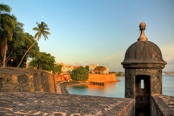 San Juan cityscape Beautiful summer afternoon at the outer wall with sentry box of fort San Felipe del Morro in old San Juan in Puerto Rico puerto rico stock pictures, royalty-free photos & images