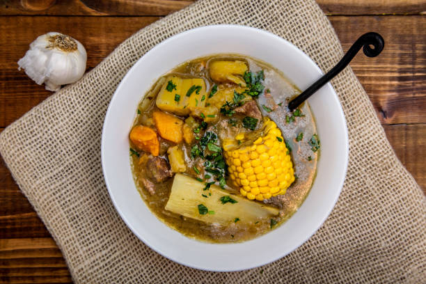 Sancocho - puerto rican beef stew on wooden table top view stock photo