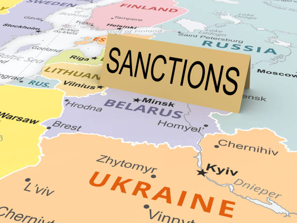 Sanctions paper card on map stock photo