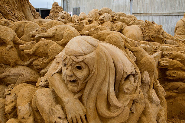 Sand sculpture of a covert with rats and black death. Sand sculpture of a covert with rats and the death. This sand sculpture is made by Bouke Atema and photograped by Bouke Atema. bubonic plague photos stock pictures, royalty-free photos & images