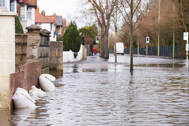 Sandbags Outside House On Flooded Road Sandbags Outside House On Flooded Road 2015 stock pictures, royalty-free photos & images