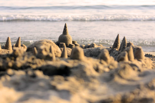 Sandcastle with the sea in the background. stock photo