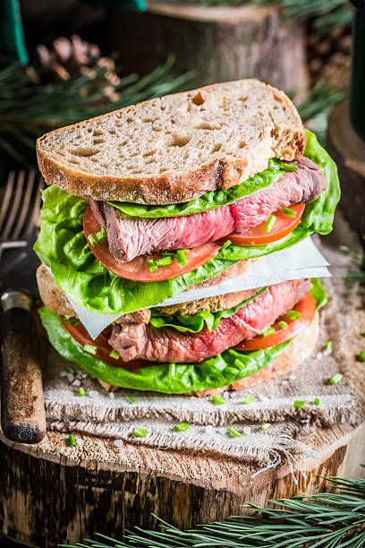 sandwich with meat and vegetables for woodcutter - pork pine bildbanksfoton och bilder