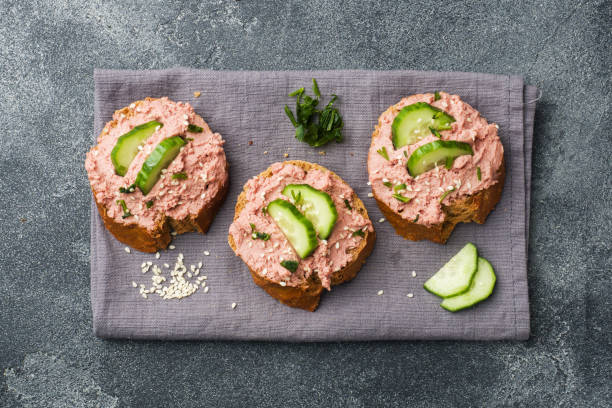 Sandwiches with chicken pate and cucumber on dark table. Sandwiches with chicken pate and cucumber on dark table pate stock pictures, royalty-free photos & images