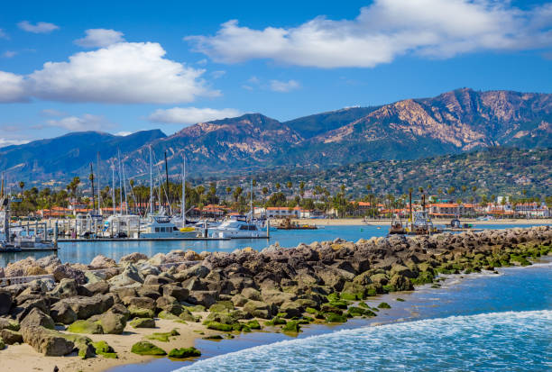 Santa Barbara Marina shoreline breakwater with recreational boats, CA stock photo