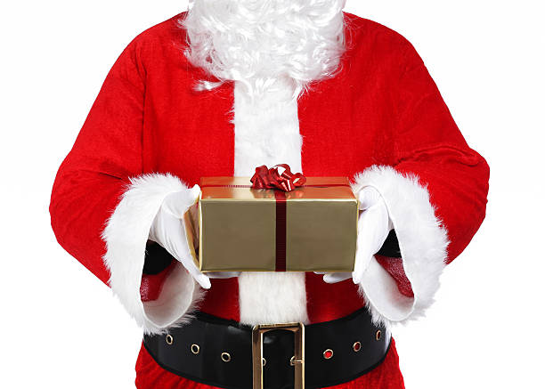 Santa Claus holding a gift stock photo