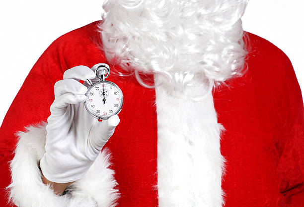 Santa Claus holding a stopwatch stock photo