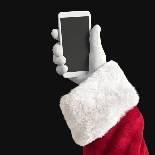 santa claus holding mobile phone, hand using smartphone isolated on black, 3d illustration. - smartphone christmas imagens e fotografias de stock
