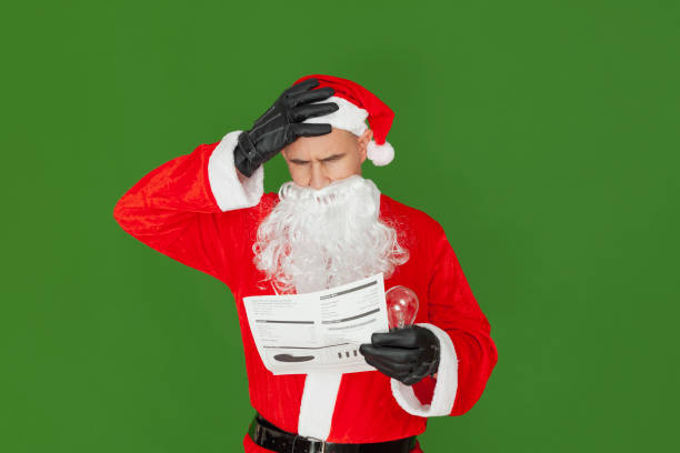 Santa Claus scandalized by the electricity bill stock photo