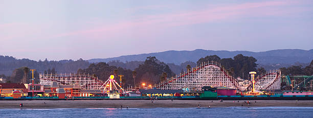 Santa Cruz boardwalk: roller coaster after sunset  boardwalk stock pictures, royalty-free photos & images