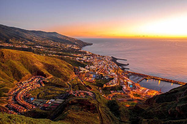 Santa Cruz city on La Palma island Aerial view on illuminated Santa Cruz city on the dusk on La Palma island in Spain canary islands stock pictures, royalty-free photos & images