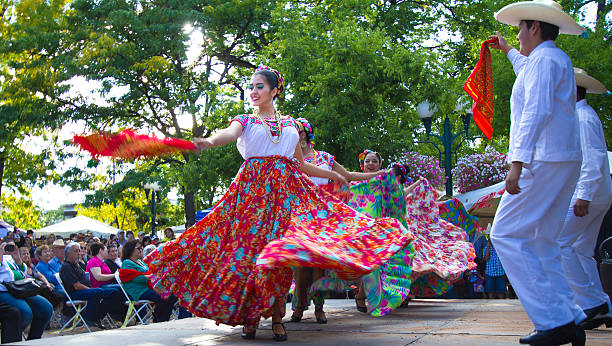 Santa Fe, NM: Troupe Performs Mexican Folk Dance on Plaza Santa Fe, NM, USA - September 17, 2016: A dance troupe performs a Mexican folk dance on the historic Santa Fe, NM Plaza during a Mexican Independence Day celebration. New Mexico was part of the Mexican Republic for 25 years and has many citizens of Mexican heritage. mexican independence day stock pictures, royalty-free photos & images