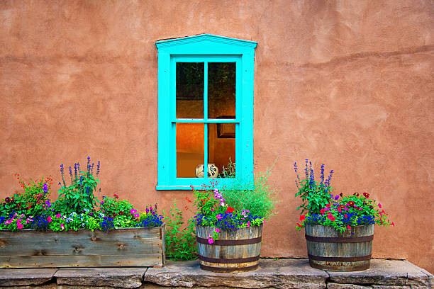 Santa Fe Style Old Turquise Window, Stucco Wall and Flowers Note for the inspector: adobe backgrounds stock pictures, royalty-free photos & images