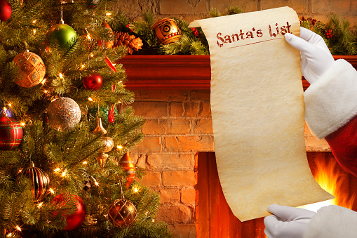 Santa Holding Blank List In Front Of Christmas Tree And ...