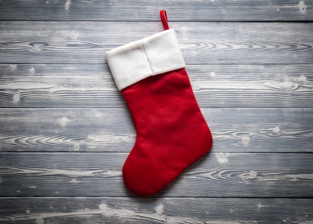 Santa red sock isolated on grey OLYMPUS DIGITAL CAMERA christmas stocking stock pictures, royalty-free photos & images
