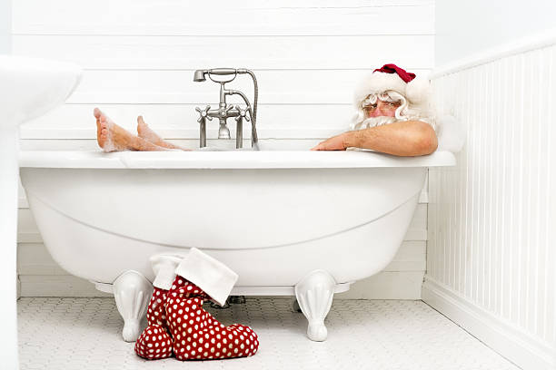 Santa taking a bath stock photo