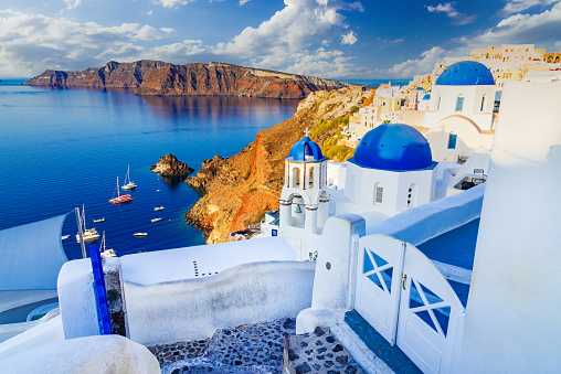 Santorini, Greece. Amazing whitewashed city of Oia, Thira in Greek Cyclades Islands, Aegean Sea. Holiday destinations of Europe.