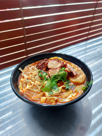 Sarawak Laksa noodles with prawns and egg stripes
