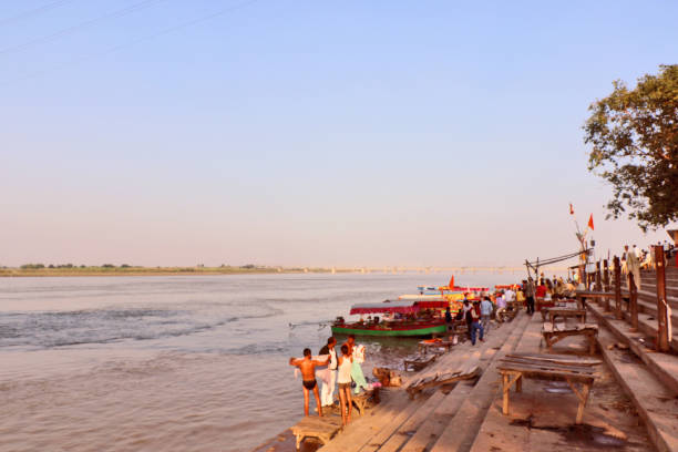 Saryu River in Ayodhya Ayodhya, India - November 17, 2017: Saryu River in Ayodhya, where lord Rama was born. It is believed that the holy river washes away impurities & sins of the town. Thousands of visitors take a bath in the holy water of Saryu daily. ghat stock pictures, royalty-free photos & images