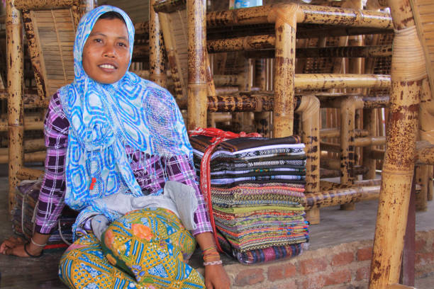 Sasak woman from village selling batik in Lombok stock photo