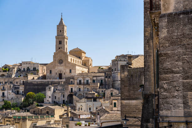 Sasso Caveoso district in Matera with Matera Cathedral on the top of the skyline, Basilicata, Italy stock photo