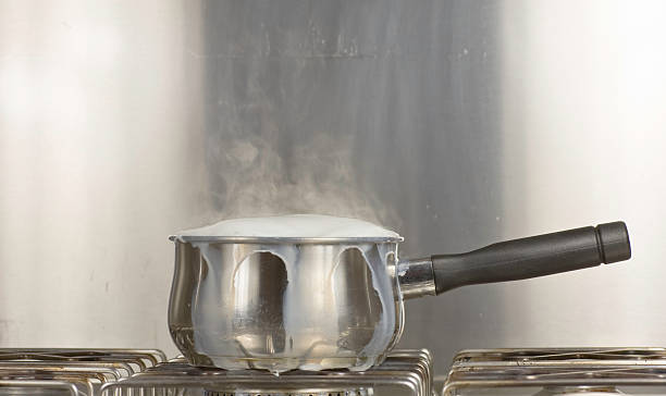 Saucepan Of Boiling Milk stock photo