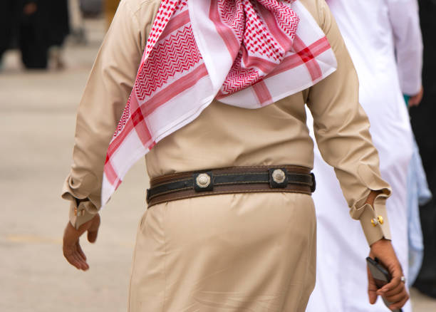Saudi Men and Women wearing traditional clothes in festival stock photo