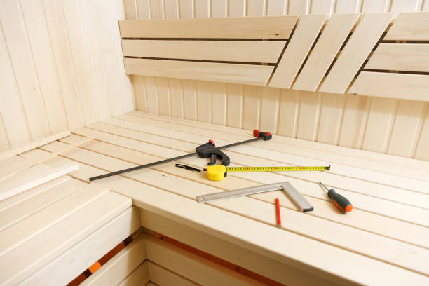 Sauna construction in progress. Wooden walls and benches stock photo