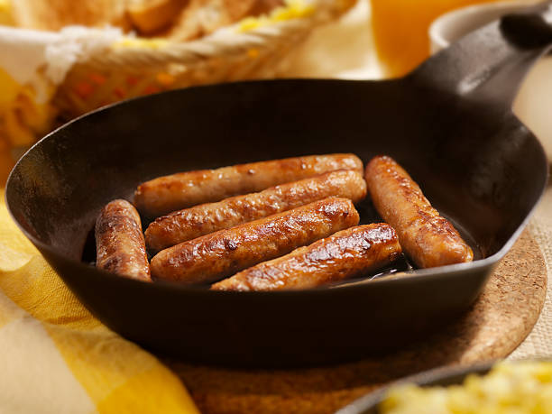 Sausages and Eggs Sausages with Scrambled Eggs and Toast - Photographed on Hasselblad H3D2-39mb Camera sausage stock pictures, royalty-free photos & images