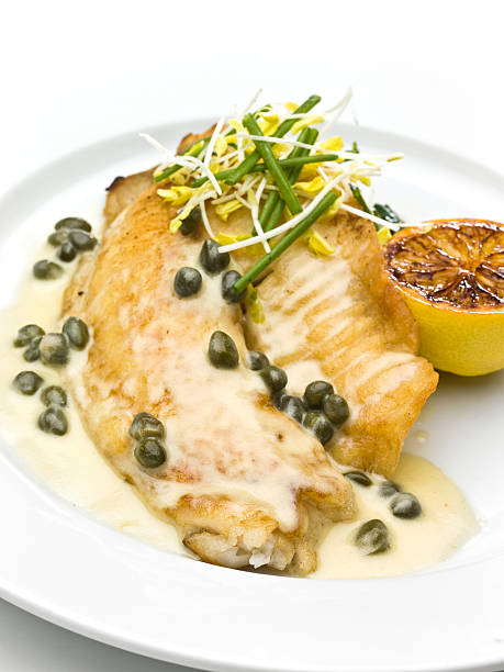 Saute fillet of tilapia with Capers Sauce Saute fillet of tilapia with Capers Sauce  (this picture has been taken with a Hasselblad H3D II 31 megapixels camera) caper stock pictures, royalty-free photos & images