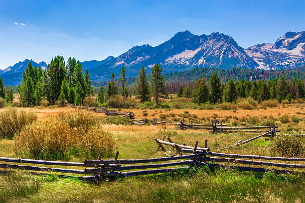 Sawtooth Mountains, ranch land, rail fence, Stanley, Idaho (ID) stock photo