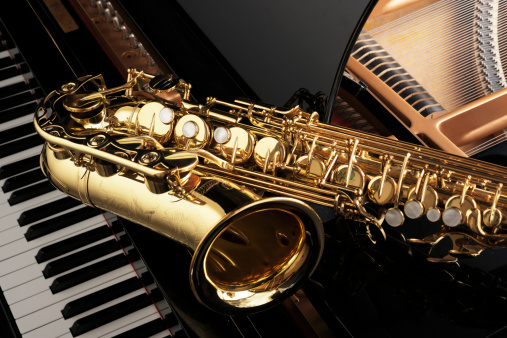 Alt saxophone on grand piano