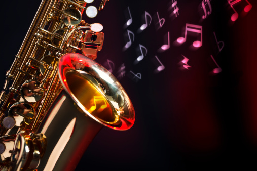 Motion-blurred musical notes rise out of the bell of an alto saxophone. Base image shot with Canon EOS 1Ds Mark III.