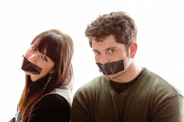 Say no more!  human mouth gag adhesive tape women stock pictures, royalty-free photos & images