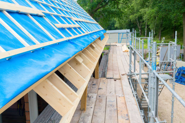 Scaffolding with roof of new house on construction site stock photo