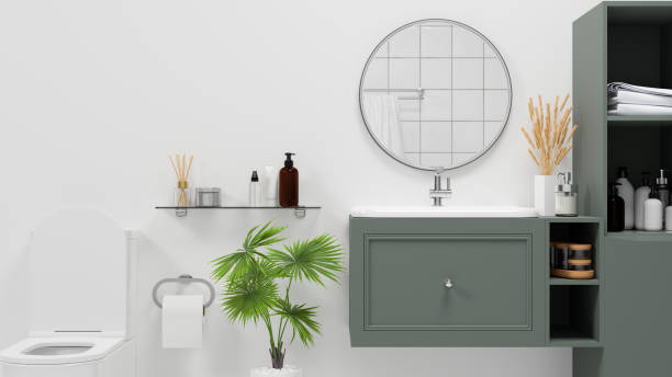 Scandinavian bathroom interior style with modern green cabinet and shelves over white wall stock photo