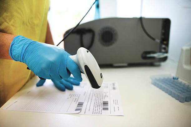 Scanning barcode by nurse - stock photo