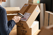 istock Scanning parcel barcode before shipment 1308840409