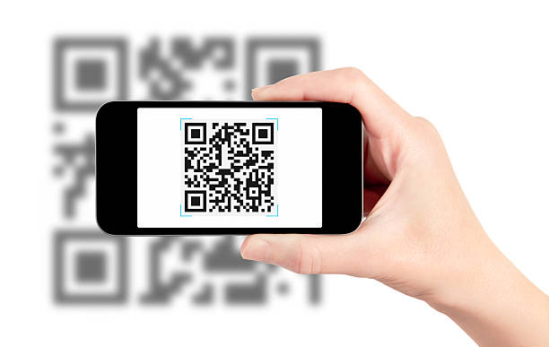 Scanning QR Code With Mobile Phone stock photo