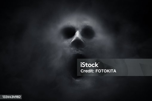istock Scary ghost on dark background 1334434982