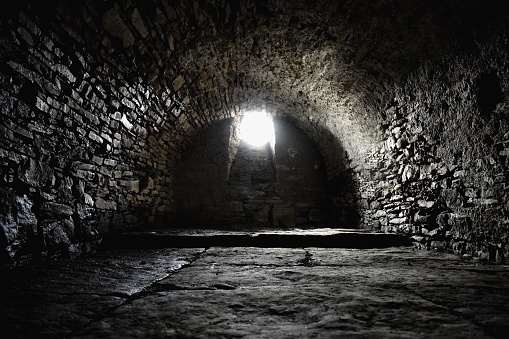 Scary underground, old stony cellar