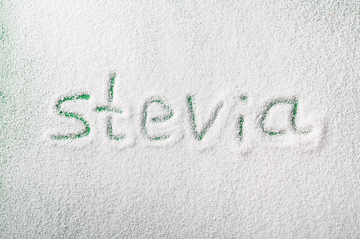 scattered organic stevia powder sweetener with lettering picture