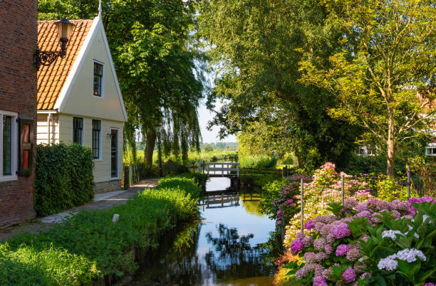 Scenery with canal in Ransdorp village, which is a part of the borough Amsterdam-Noord Ransdorp is a village in the province of North Holland, Netherlands, part of the municipality of Amsterdam amsterdam noord stock pictures, royalty-free photos & images