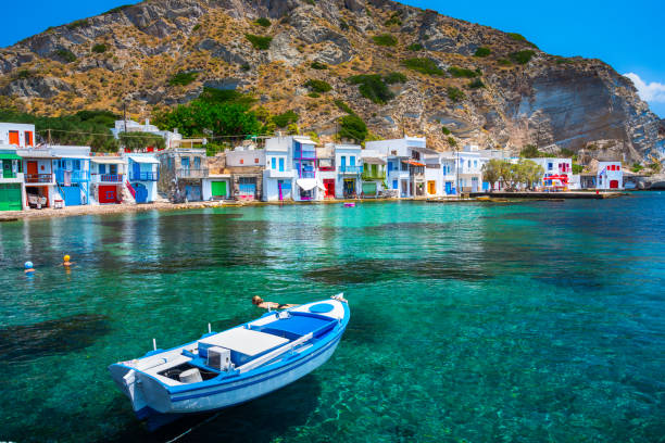 Scenic Klima village (traditional Greek village by the sea, the Cycladic-style) with sirmata - traditional fishermen's houses, Milos island, Cyclades, Greece. stock photo