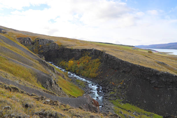 Scenic landscape near the trail leading to the Litlanesfoss and Hengifoss waterfalls. View of the Hengifossargljufur gorge and the Fljotsdalur valley in East Iceland. stock photo