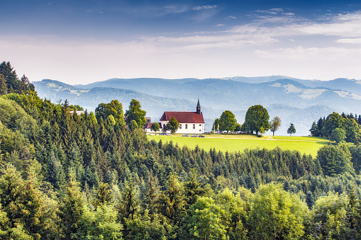 Scenic mountain landscape with an old church in the Black Forest, Germany.