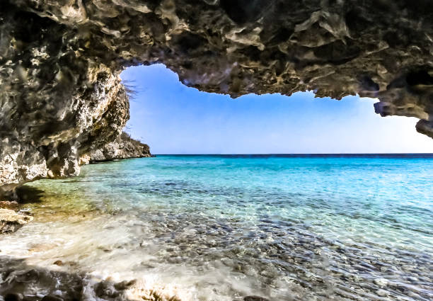 Scenic natural sea cave on the island of Curaçao in the Caribbean stock photo