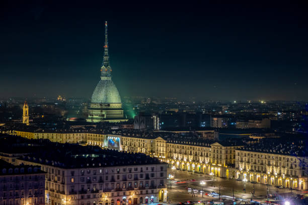 Scenic night cityscape of Turin with the Mole Antonelliana and Vittorio square lighted for the new year celebrations. Italy stock photo