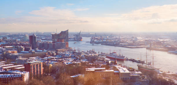 Scenic panorama view from Dancing Towers over Hamburg under snow in winter with Speicherstadt, harbor, and New Elbe Philharmonic Theater, Elbphilharmony. Scenic panorama view from Dancing Towers over Hamburg under snow in winter with Speicherstadt, harbor warehouses and New Elbe Philharmonic Theater, Elbphilharmony. elbe river stock pictures, royalty-free photos & images